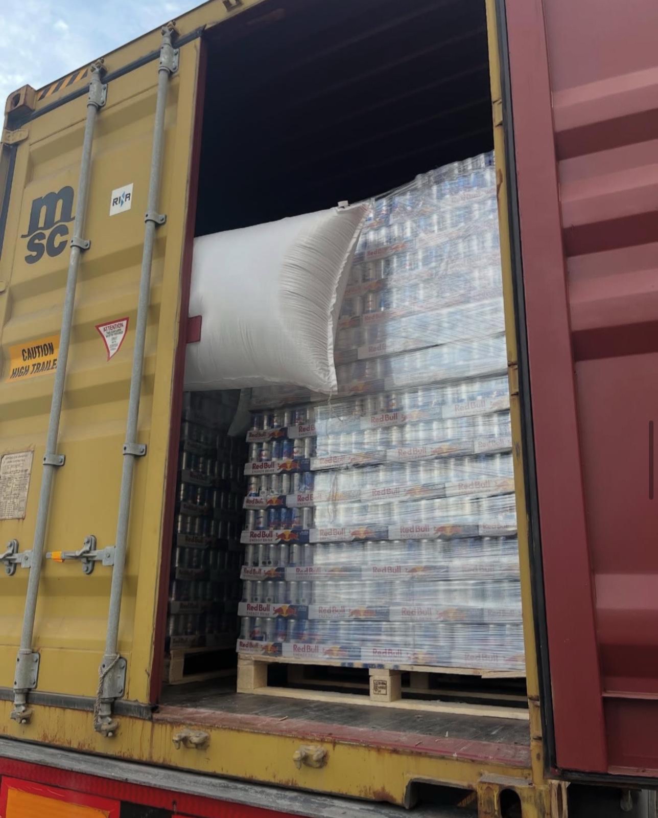 Wholesale energy drink pallets staged for truck loading
