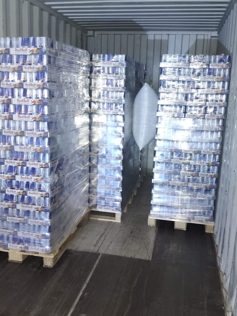 Wholesale energy drink pallets loaded in a trailer for delivery to a vending operator's warehouse